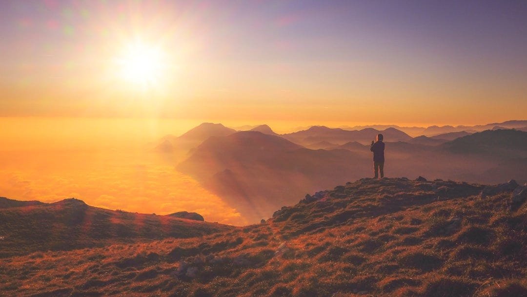 Person climbing mountain